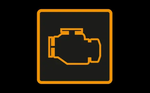 Icône de moteur orange sur fond noir. Le voyant moteur clignote, signalant un problème potentiel.